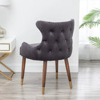 Poltrona d'accento rivestita in poliestere grigio con gambe in legno di gomma